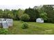 A view of a well-maintained back yard, deck and storage shed at 3124 Banks St, Lincolnton, NC 28092