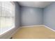 Bedroom with neutral walls, window, and carpet at 3124 Banks St, Lincolnton, NC 28092