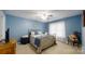 Comfortable bedroom with neutral walls, large window, and ceiling fan at 3124 Banks St, Lincolnton, NC 28092
