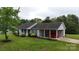 Charming single story home with a car port and a well-manicured lawn at 3124 Banks St, Lincolnton, NC 28092
