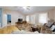 Bright living room with hardwood flooring, neutral walls, and a decorative area rug at 3124 Banks St, Lincolnton, NC 28092