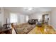 Cozy living room features hardwood floors, vaulted ceilings, and a decorative area rug at 3124 Banks St, Lincolnton, NC 28092