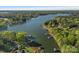 Stunning aerial view showcasing the lake, lush greenery, and surrounding waterfront properties at 327 Kenway Loop, Mooresville, NC 28117