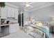 Comfortable bedroom with beverage bar, soft natural lighting, and a cozy aesthetic at 327 Kenway Loop, Mooresville, NC 28117