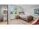 Well-lit bedroom featuring wood floors, and a large window for plenty of natural light at 327 Kenway Loop, Mooresville, NC 28117