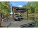 Modern boat dock with covered lift, providing convenient and secure storage for watercraft at 327 Kenway Loop, Mooresville, NC 28117