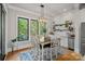 Cozy dining area with bright windows and rustic shelving offering charming details and natural light at 327 Kenway Loop, Mooresville, NC 28117