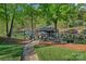 Picturesque waterfront dock with ample seating, umbrellas, and direct access to the lake at 327 Kenway Loop, Mooresville, NC 28117