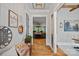 Elegant entryway with wood floors, white trim, and decorative accents leading into other living spaces at 327 Kenway Loop, Mooresville, NC 28117