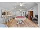 Spacious game room with a pool table, bar stools, and a relaxing seating area with hardwood floors at 327 Kenway Loop, Mooresville, NC 28117