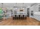 Modern kitchen with white cabinets, a large center island, and stainless steel appliances at 327 Kenway Loop, Mooresville, NC 28117
