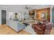 Spacious living room featuring a stone fireplace, hardwood floors, and ample seating at 327 Kenway Loop, Mooresville, NC 28117