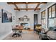 Cozy office with exposed wood beams, a large window, and a decorative fireplace at 327 Kenway Loop, Mooresville, NC 28117