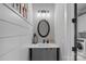 Stylish powder room with elegant vanity, modern fixtures, and decorative mirror at 327 Kenway Loop, Mooresville, NC 28117