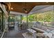 Relaxing screened porch with outdoor seating, dining area, and scenic lake views at 327 Kenway Loop, Mooresville, NC 28117
