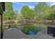 Beautiful waterfront property featuring a dock, gazebo, and tranquil lake views at 327 Kenway Loop, Mooresville, NC 28117