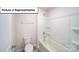 Bright bathroom features a tub with white tile surround and chrome hardware at 3404 Lacebark Ln, Gastonia, NC 28056