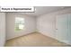 Bedroom with neutral carpet and a window offering natural light at 3404 Lacebark Ln, Gastonia, NC 28056
