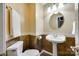 A half-bathroom features toilet and pedestal sink at 4307 Edgeland Rd, Edgemoor, SC 29712