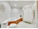 Bright bathroom features a tub, a standing shower, and a toilet at 4307 Edgeland Rd, Edgemoor, SC 29712