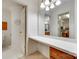 Bright bathroom featuring a vanity with a long countertop and large mirror reflecting the walk-in closet at 4307 Edgeland Rd, Edgemoor, SC 29712