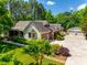 Aerial view of house with spacious driveway and three car garage surrounded by manicured landscaping at 4307 Edgeland Rd, Edgemoor, SC 29712