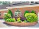 Lovely brick house exterior featuring an elegant water fountain set among lush landscaping at 4307 Edgeland Rd, Edgemoor, SC 29712