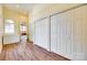 Bright hallway featuring hardwood floors and closet doors at 4307 Edgeland Rd, Edgemoor, SC 29712