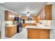 Well-appointed kitchen with wood cabinets, granite countertops, and black appliances at 4307 Edgeland Rd, Edgemoor, SC 29712