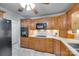 Bright kitchen with wood cabinets, modern appliances, and tiled floors at 4307 Edgeland Rd, Edgemoor, SC 29712