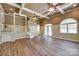 An expansive living space with hardwood floors, stairs, a fireplace, and lots of natural light at 4307 Edgeland Rd, Edgemoor, SC 29712