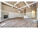 A spacious living area showcasing beautiful hardwood floors and a cozy stone fireplace at 4307 Edgeland Rd, Edgemoor, SC 29712