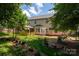 Expansive backyard featuring a beautiful garden, gazebo, and meticulously maintained landscaping at 461 Pier Point Nw Ct, Concord, NC 28027