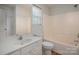Bright bathroom featuring a tub-shower combo, window, and a vanity with ample storage space at 461 Pier Point Nw Ct, Concord, NC 28027