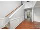 A welcoming entryway with hardwood floors, staircase, and decorative molding for an elegant touch at 461 Pier Point Nw Ct, Concord, NC 28027