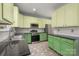 Well-equipped kitchen showcasing granite countertops, tiled backsplash, and modern appliances at 461 Pier Point Nw Ct, Concord, NC 28027