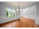 Inviting living room boasting large windows, hardwood floors, and neutral wall paint at 461 Pier Point Nw Ct, Concord, NC 28027