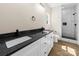 Stylish bathroom with double vanity, granite countertops, modern fixtures, and tiled shower at 503 Eddleman Rd, Kannapolis, NC 28083
