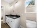 Bathroom features a dual sink vanity with black granite countertops and a window at 503 Eddleman Rd, Kannapolis, NC 28083
