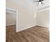 Inviting bedroom with tray ceiling, wood-look flooring, and neutral color palette at 503 Eddleman Rd, Kannapolis, NC 28083
