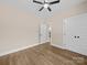 Bedroom features wood-look floors, ceiling fan, and closet at 503 Eddleman Rd, Kannapolis, NC 28083
