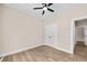 Bedroom boasts modern ceiling fan, neutral walls, and wood-look flooring at 503 Eddleman Rd, Kannapolis, NC 28083