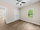 Bedroom with natural light, ceiling fan, closet, and wood-look floors at 503 Eddleman Rd, Kannapolis, NC 28083