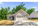 Charming single-Gathering home featuring a two-car garage and freshly laid lawn with blue sky at 503 Eddleman Rd, Kannapolis, NC 28083