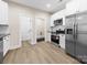 Modern kitchen with stainless steel appliances, sleek countertops, and ample cabinet space at 503 Eddleman Rd, Kannapolis, NC 28083