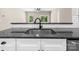 Modern kitchen sink with granite countertops, stylish faucet, and white subway tile backsplash at 503 Eddleman Rd, Kannapolis, NC 28083