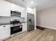 Well-equipped kitchen featuring stainless steel appliances and white cabinets, bright and clean at 503 Eddleman Rd, Kannapolis, NC 28083
