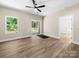 Bright living room with sliding glass door, wood-look floors and lots of natural light at 503 Eddleman Rd, Kannapolis, NC 28083