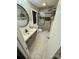 A modern bathroom with glass shower, granite countertops, and tiled floor at 5050 Forest Ridge Dr, Hickory, NC 28602