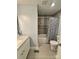 Bathroom featuring a shower/tub combo and a single sink vanity with neutral wall color at 5050 Forest Ridge Dr, Hickory, NC 28602